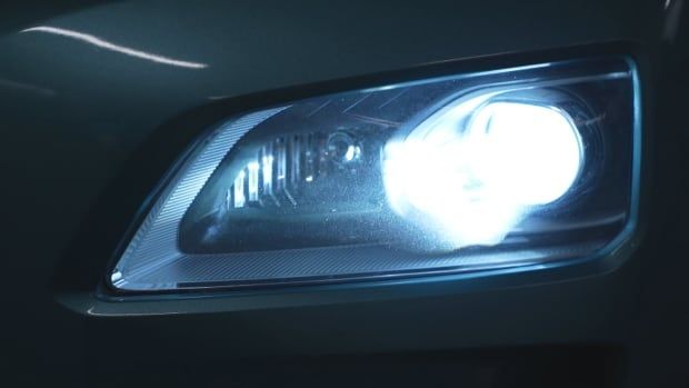 A car headlights on bright with an LED bulb.