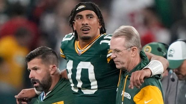 Green Bay Packers male quarterback is helped off the field after getting hurt during the second half of an NFL football game against the Philadelphia Eagles, Saturday, Sept. 7, 2024, at the Neo Quimica Arena in Sao Paulo, Brazil.