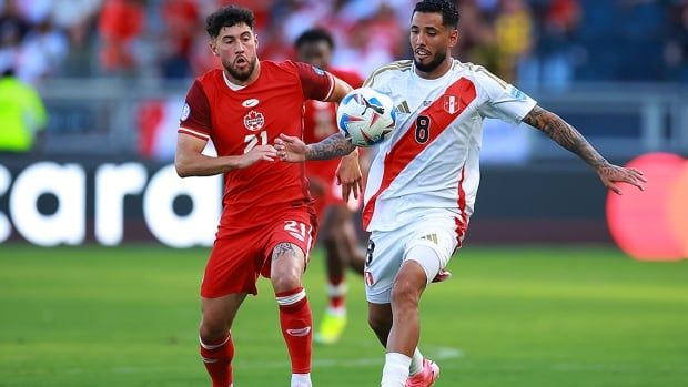 Canadian men's soccer player Jonathan Osorio battles for possession with Sergio Peña of Peru during the CONMEBOL Copa America tournament at Children's Mercy Park on June 25, 2024 in Kansas City, Kansas.