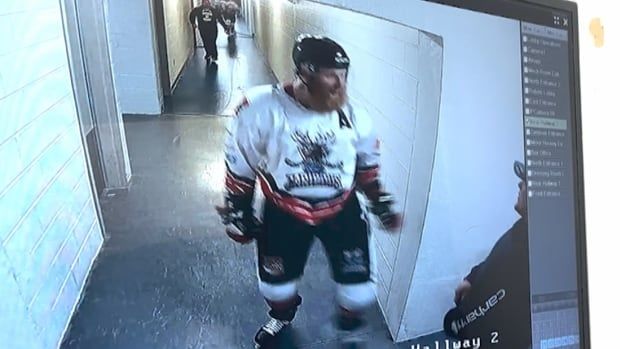 a video screen grab featuring a hockey player ready to fight