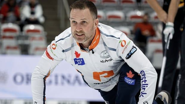 St. John's skip Brad Gushue watches his shot against Mike McEwen during the men's curling final at the PointsBet Invitational in Calgary on Sept. 29, 2024. 