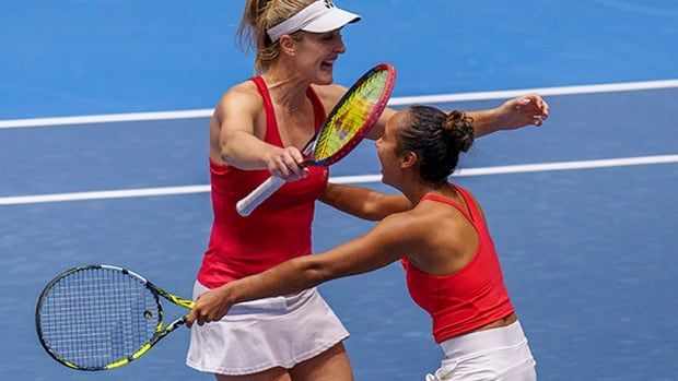 Canada's Gabriela Dabrowski and Leylah Fernandez hug after defeating Czech Republic's Barbora Krejcikova and Katerina Siniakova during their doubles semifinal tennis match at the Billie Jean King Cup finals on Nov. 2023 Seville, Spain.