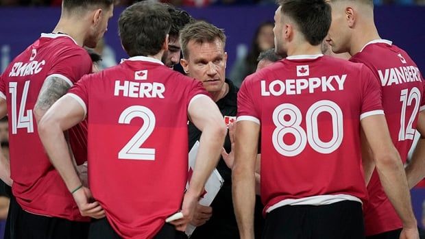 Canada national men's volleyball coach Tuomas Sammelvuo talks to players during a group match against Slovenia at the Paris Olympics on July 28, 2024 in France.  