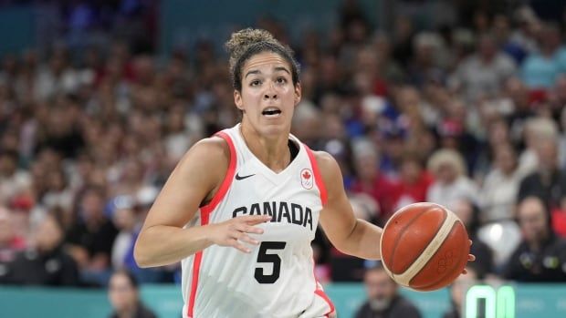 Kia Nurse, of Canada, plays against France in a women's basketball game at the 2024 Summer Olympics, Monday, July 29, 2024, in Villeneuve-d'Ascq, France.