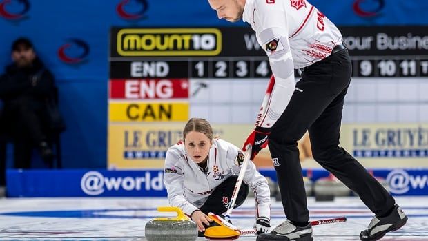 Jocelyn Peterman and Brett Gallant display their gold medals after defeating Tyrel Griffith and Nancy Faye Martin 9-6 to win the Canadian mixed doubles curling championship at Willie O'Ree Place in Fredericton, N.B. on March 24, 2019.