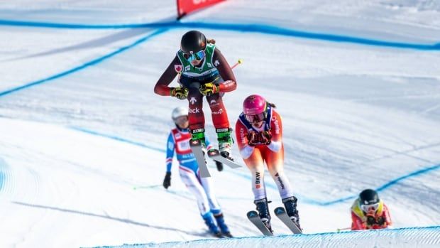 A skier flies through the air during a race.