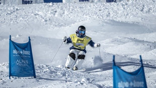 Australian female skier takes on the moguls. 