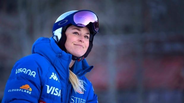 Close up of female skier smiling.