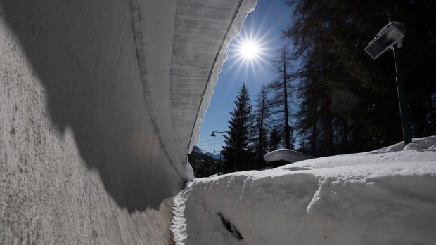 A bobsled track covered in snow.