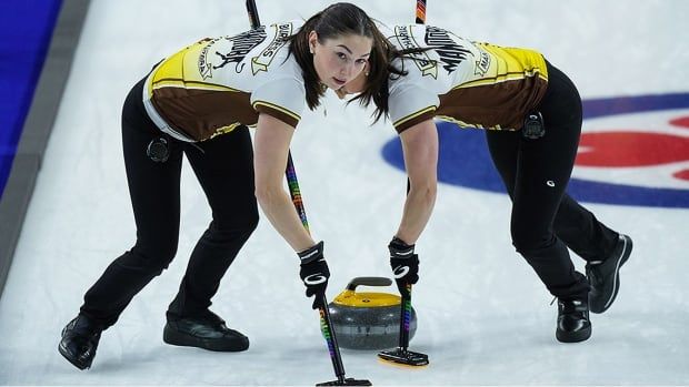 Manitoba third Karlee Burgess and second Mackenzie Zacharias sweep while playing for Team Wildcard 3 at the Scotties Tournament of Hearts in Kamloops, B.C., on February 19, 2023. 