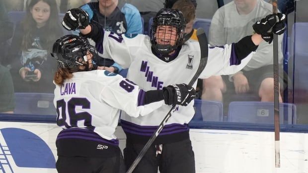 Two female hockey players.