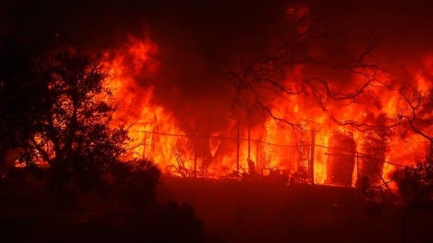 Wild fire burining a house.