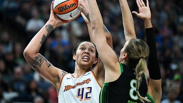 Brittney Griner of the Phoenix Mercury shoots the ball over defender Alanna Smith of the hometown Minnesota Lynx in Game 2 of a first-round WNBA playoff series on September 25, 2024 in Minneapolis.