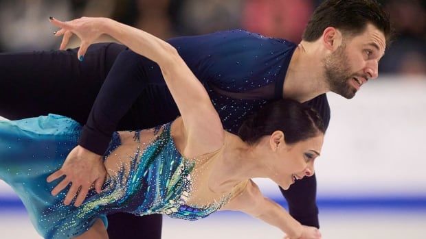 A pairs figure skating team competes.