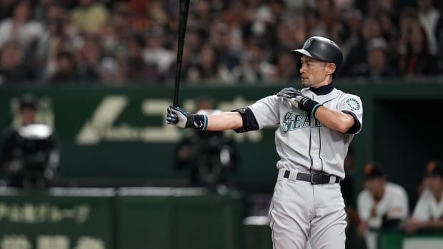 A men's baseball player at bat.