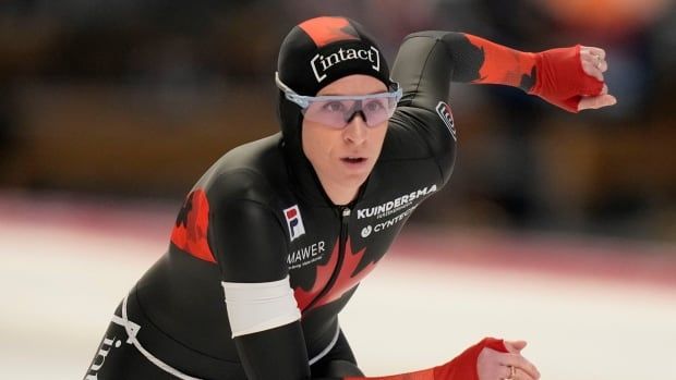 A women's speed skater competes.