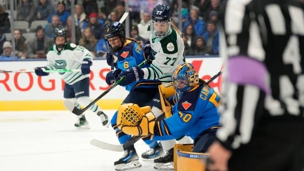 Toronto Sceptres goalie Kristen Campbell (50) makes save as Boston Fleet's Susanna Tapani (77) and Toronto's Kali Flanagan (6) look for a rebound during first period PWHL hockey action in Toronto on Saturday, Nov. 30, 2024. THE CANADIAN PRESS/Frank Gunn