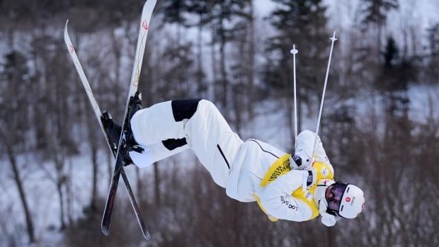 Male freestyle skier spinning in the air 