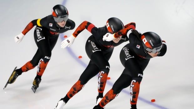 A women's speed skating team competes.