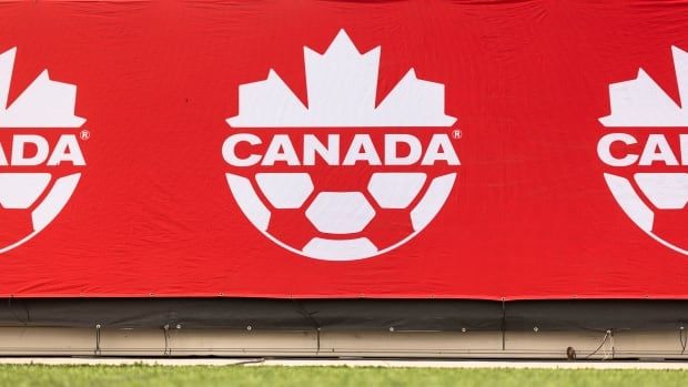 A Canada Soccer logo is shown above a field.