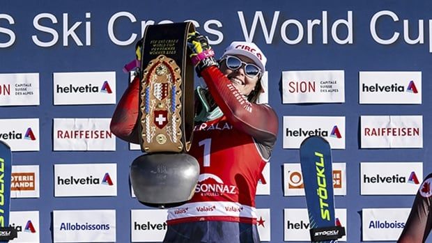 Canadian athlete Marielle Thompson celebrates on the medal podium after capturing gold in a women's World Cup ski cross event in Veysonnaz, Switzerland on February 1, 2025.