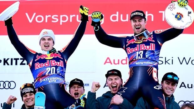 Canadian men's skiers Jack Crawford and Cam Alexander celebrate their first- and third-place finishes after a World Cup downhill competition on January 25, 2025 in Kitzbuhel, Austria.