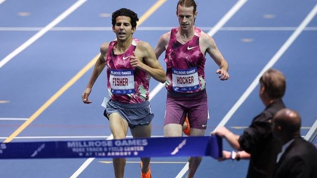 American runner Grant Fisher celebrates after winning the men's 3,000 metres and breaking the world record at the 117th Millrose Games at The Armory track and field center in New York City on February 8, 2025. 