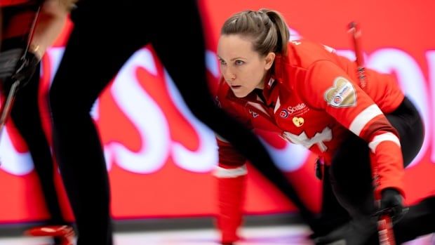 A women's curling skip competes.