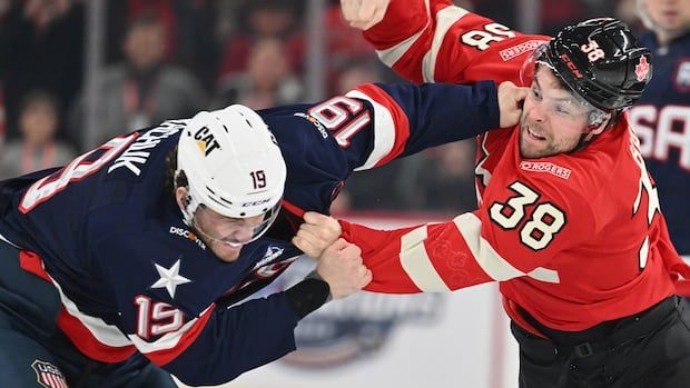 Canadian and American player fighting during 4 Nations Face-Off round robin game