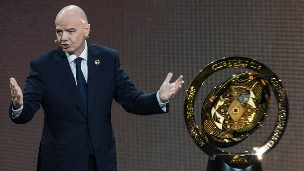 FIFA President speaks on stage. 