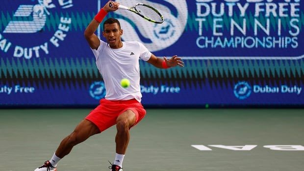 Canada's Felix Auger-Aliassime returns a forehand during first-round action against Kazakhstan's Alexander Bublik at the Dubai Tennis Championships on February 25, 2025. 