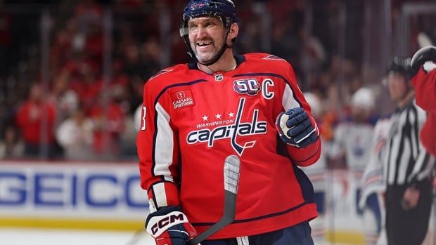 Washington Capitals forward Alex Ovechkin smiles in celebration after teammate Jakob Chychrun scored a goal against the visiting Edmonton Oilers during the first period at Capital One Arena on February 23, 2025 in DC.