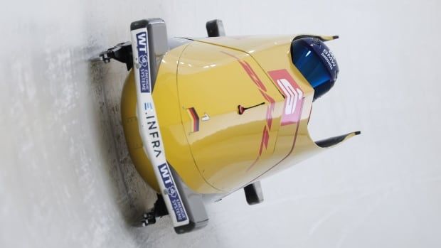 Two man bobsleigh round the corner on bobsleigh course