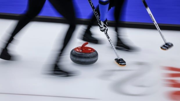 Curling brooms are shown.