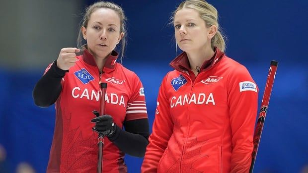 Canada skip Rachel Homan talks to teammate Sarah Wilkes during a round-robin match against Denmark at the world women’s curling championship in Uijeongbu, South Korea on March 17, 2025.