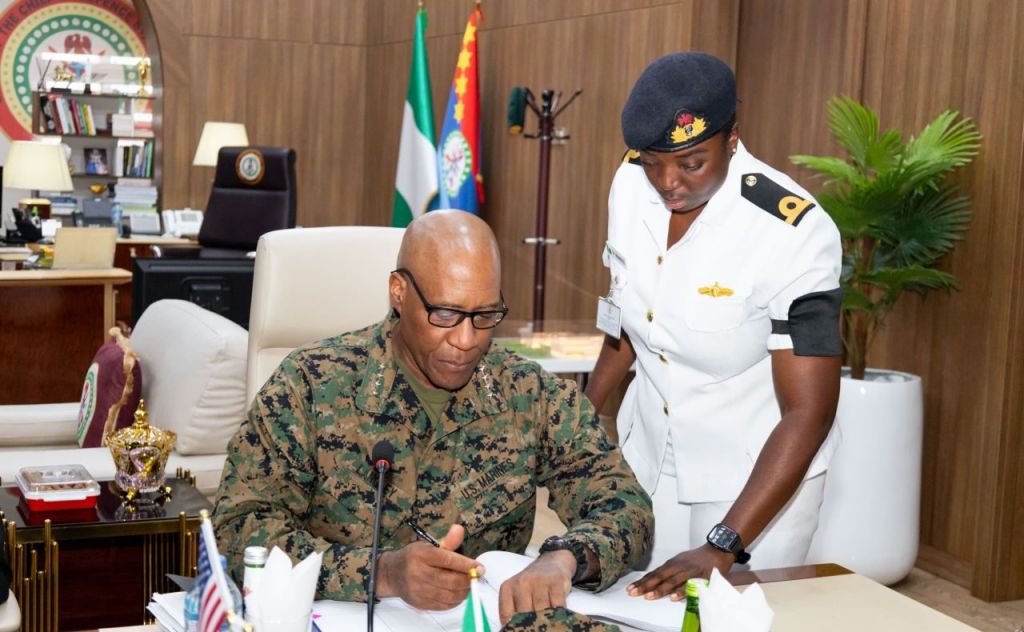 U.S. AFRICOM General Michael Langley signs Nigeria’s Chief of Defence Staff, Gen. Christopher Musa’s visitor book, Nigeria Defence HQ, Abuja, Nigeria, Nov. 8, 2024. (PHOTO CREDIT: Major Mahalia Frost. U.S Africa Command)