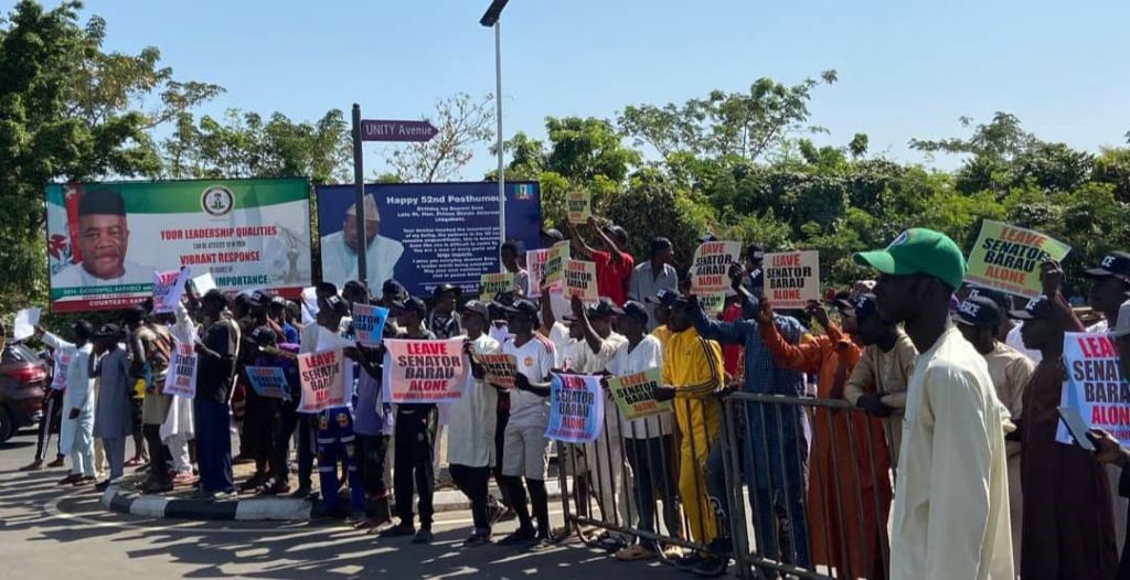 Protesters at the National Assembly, warning critics to stop verbal attacks on Deputy Senate President