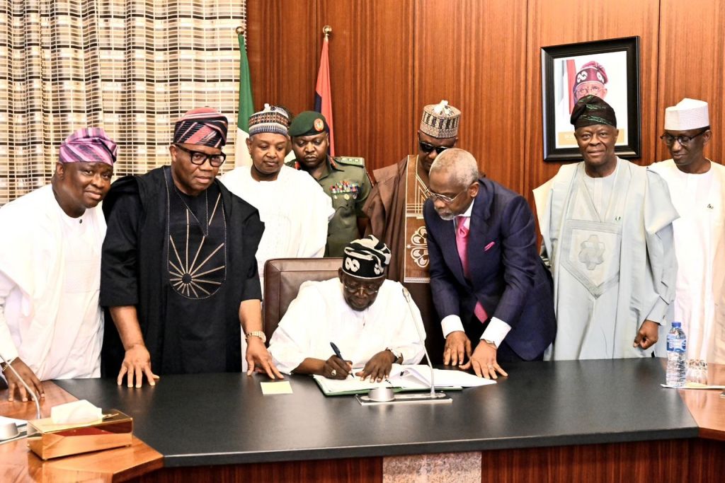 President Bola Ahmed Tinubu signing the 2025 Appropriation Bill into law. With him are; Chairman Senate Committee on Appropriation, Solomon Olamikan; President of the Senate Godswill Akpabio; Minister of National Planning, Atiku Bagudu; Speaker House of Representatives, Tajudeen Abbas; Chief of Staff to the President, Femi Gbajabiamila; Minister of Finance, Wale Edun; National Security Adviser, Nuhu Ribadu and FCT Minister, Nyeson Wike at the Presidential Villa, Abuja on Friday.