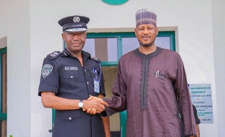 Governor Dikko Umaru Radda (R) congratulates Abubakar Sadiq Aliyu, a newly promoted assistant inspector general of police (AIG)