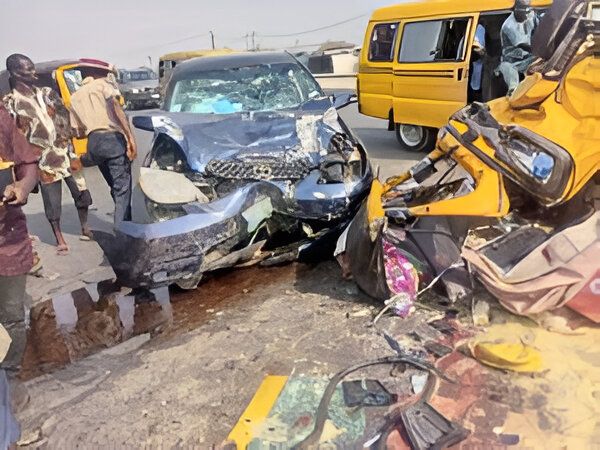 The relics of Toyota Matrix car and Bajaj Tricycle that collided along Lagos-Badagry Expressway on Saturday