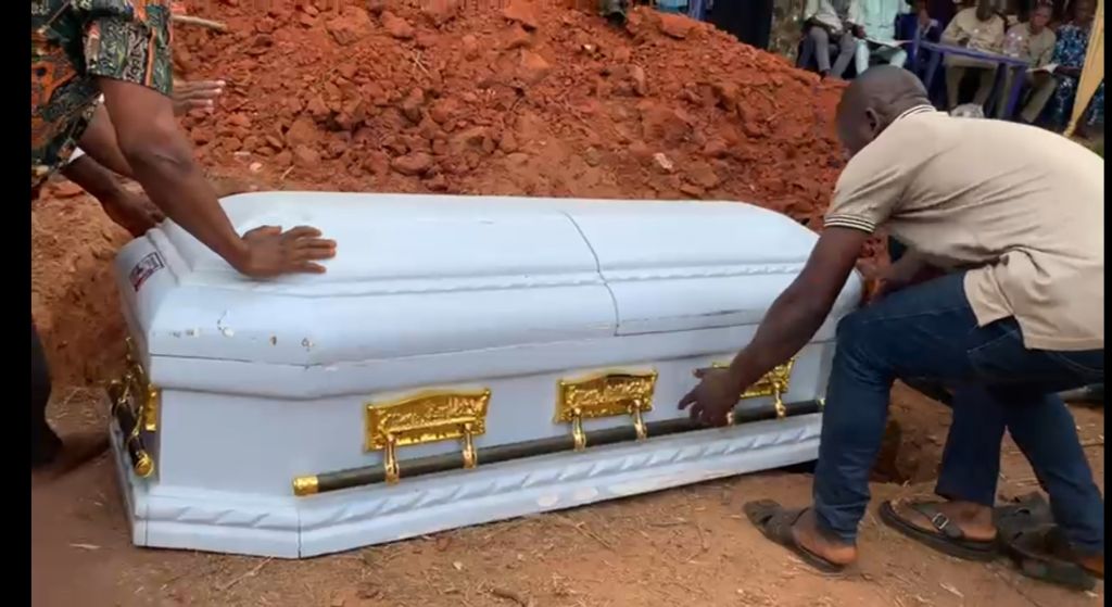 Body of the truck driver being buried