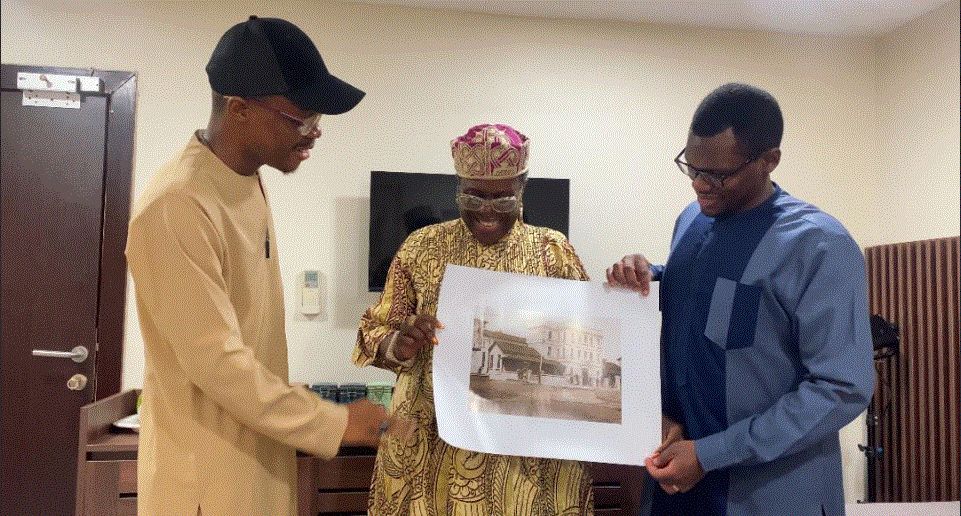 From Left Taiwo Adeyemi, Co-CEO Glover Memorial Hall Joke Silva, Head of Business Development, Lufodo Group Olusoji Jacobs, receiving an original photo of the then-Glover Memorial Hall before it's refurbishment.jpg